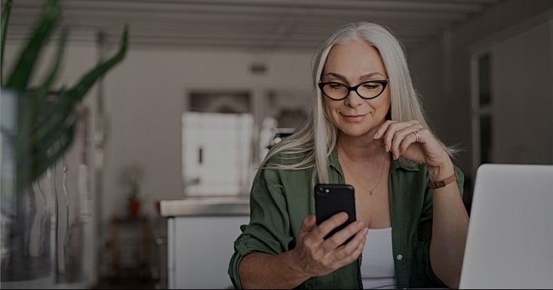 Woman on phone at computer