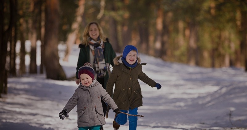 Kids running on winter trail