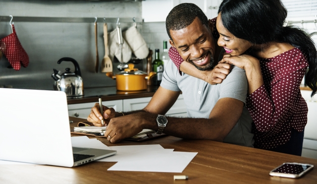 Couple happy at computer