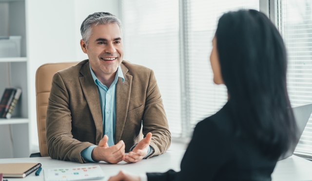 Professional talking at desk