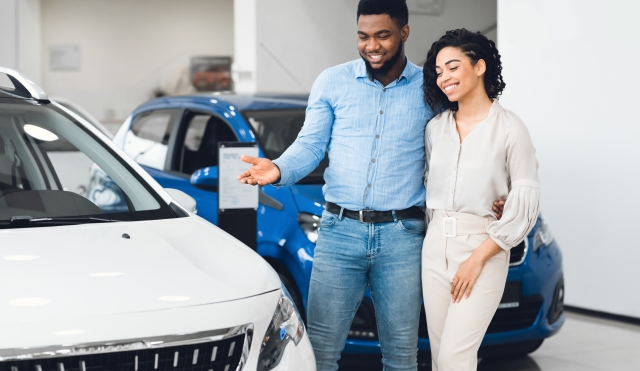 Couple looking at car