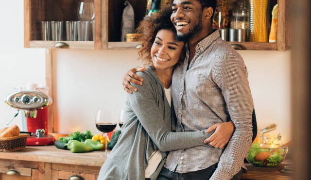 Couple hugging in kitchen