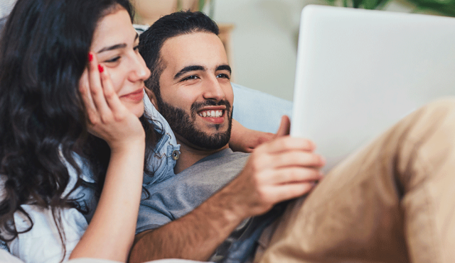 Couple looking at laptop