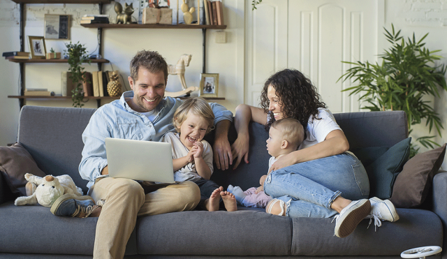 Family on couch with kids