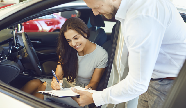 Woman Signing for Car