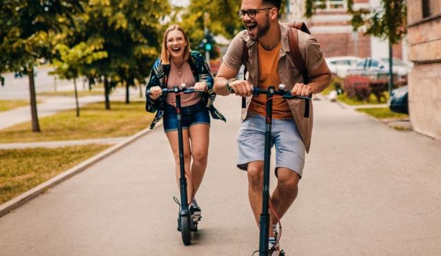 young adults on scooters