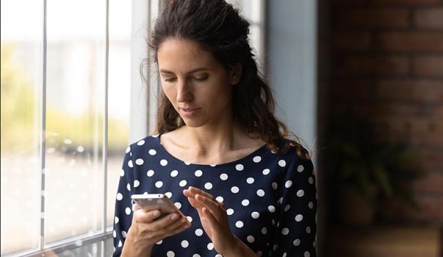 woman looking at phone