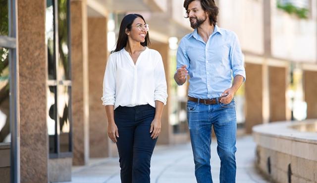 Friends walking by building