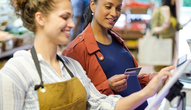 Woman paying with debit