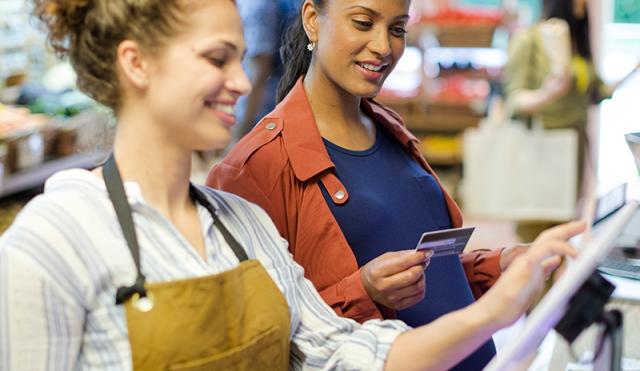 Woman paying with debit