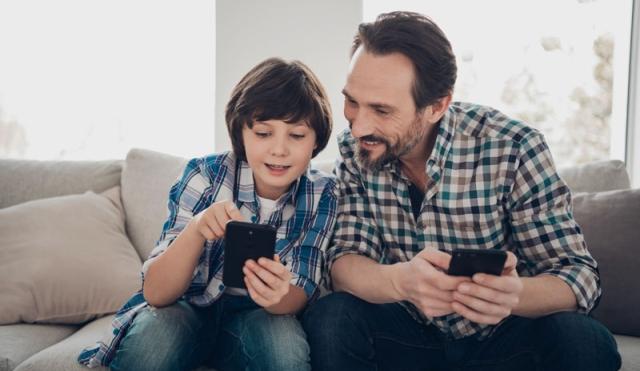 Dad and Son looking at phone