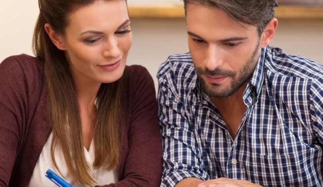 Couple reviewing their financial accounts.