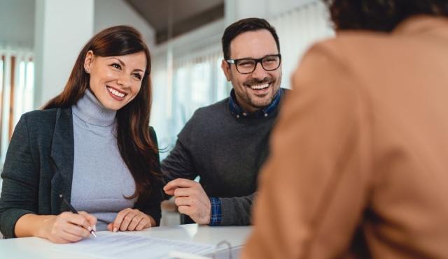 Couple joining a credit union or bank.