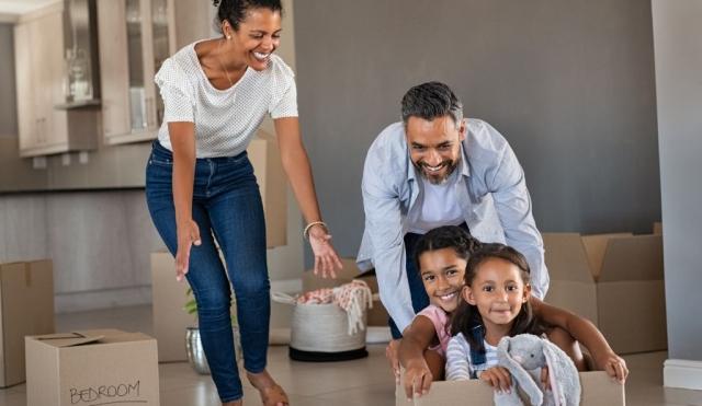 Family having fun in new house