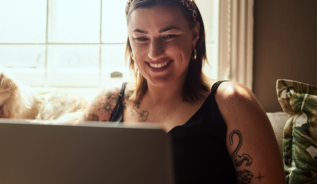 woman on laptop smiling