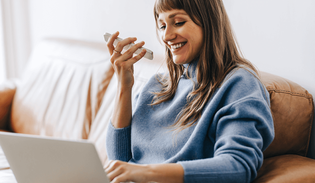 woman on laptop and phone