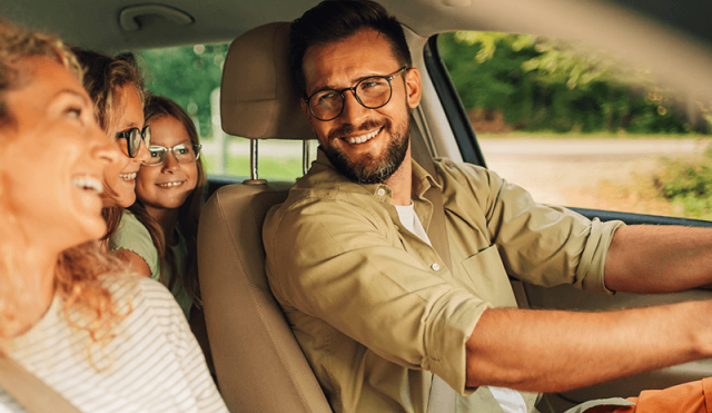 family looking at each other inside a vehicle