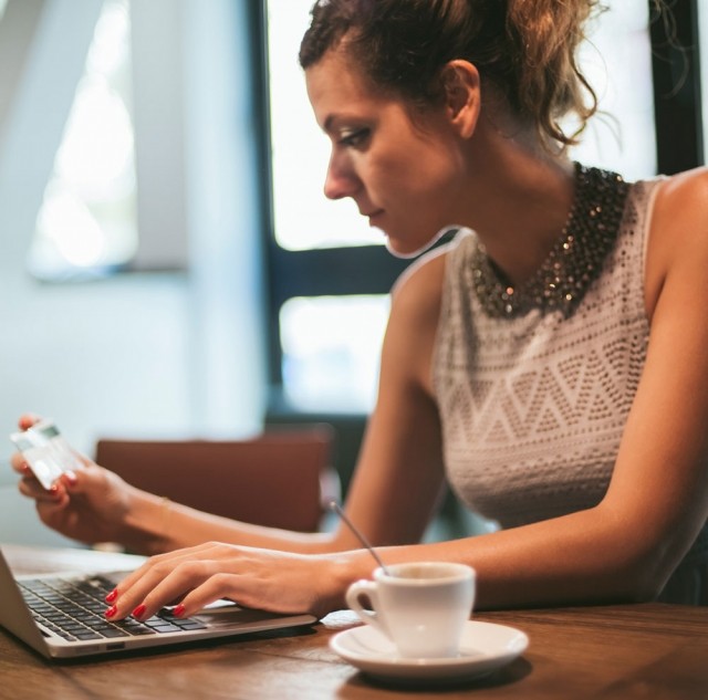 Woman at table with computer