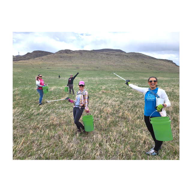 a group of volunteers pose during a park clean up