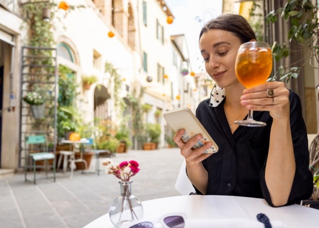 woman with wine and app