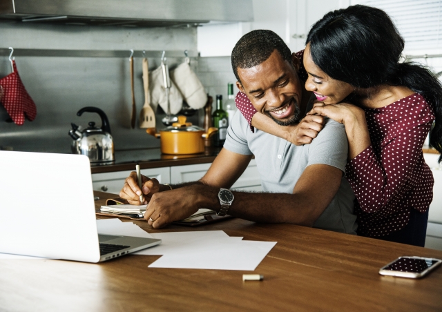 Couple happy at computer