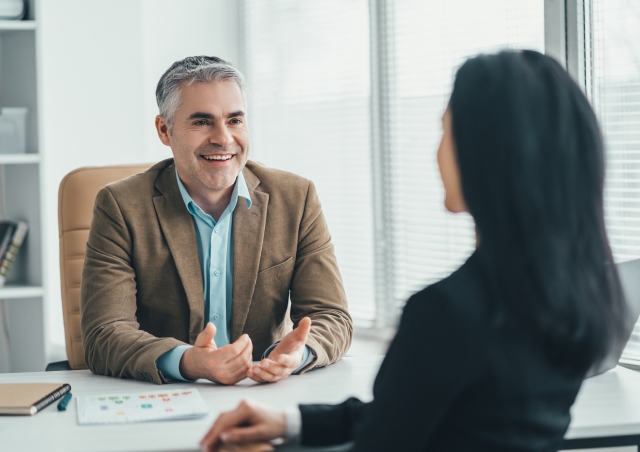 Professional talking at desk