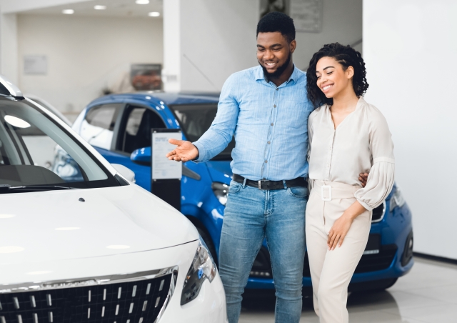 Couple looking at car