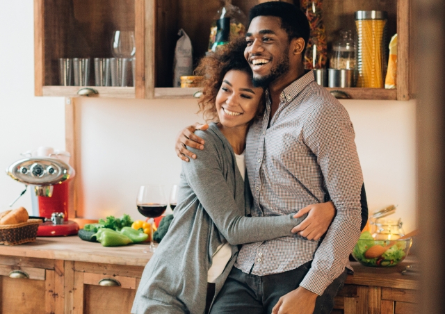 Couple hugging in kitchen