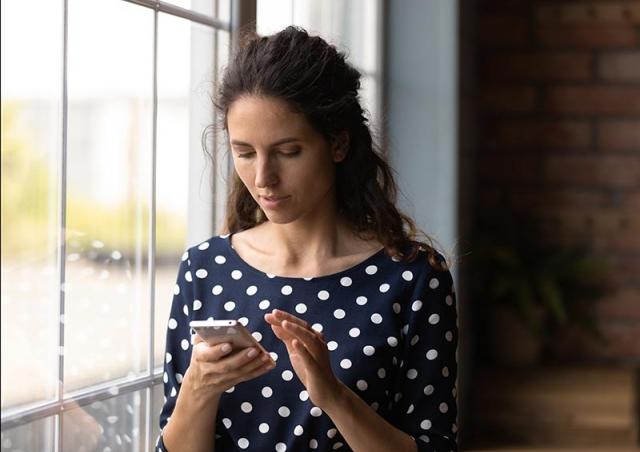 woman looking at phone