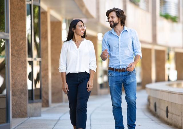 Friends walking by building