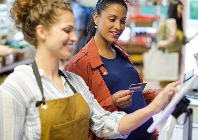 Woman paying with debit