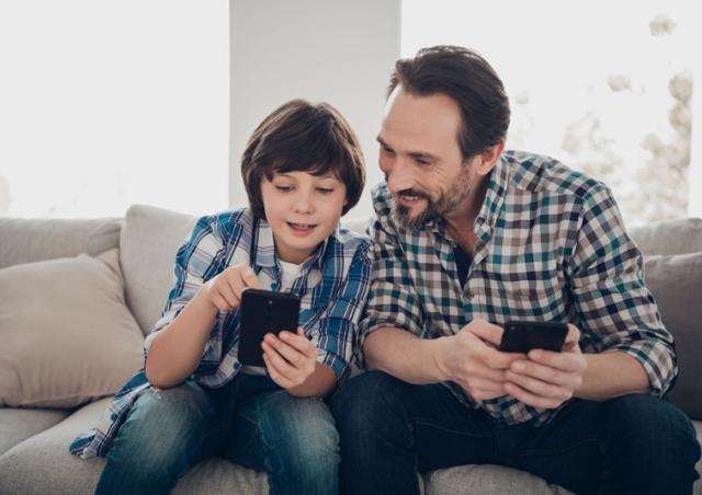Dad and Son looking at phone