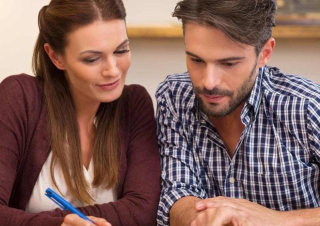 Couple reviewing their financial accounts.