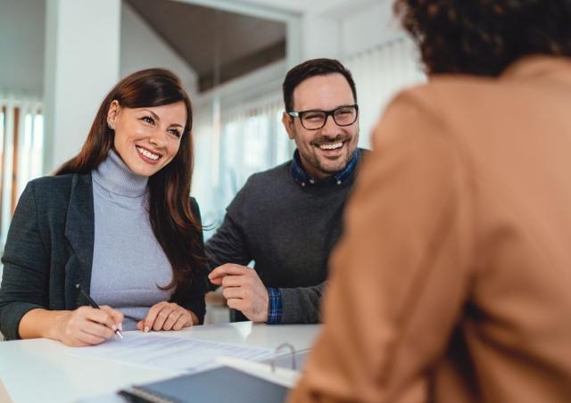 Couple joining a credit union or bank.