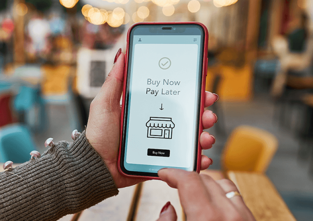 Phone with "Buy Now, Pay Later" on screen