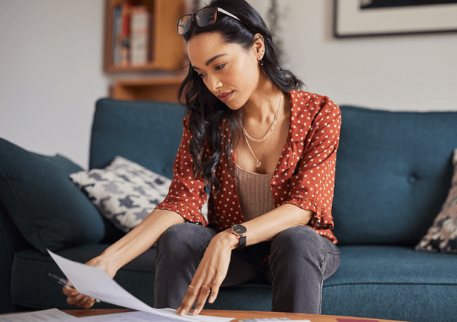 Woman looking at bills