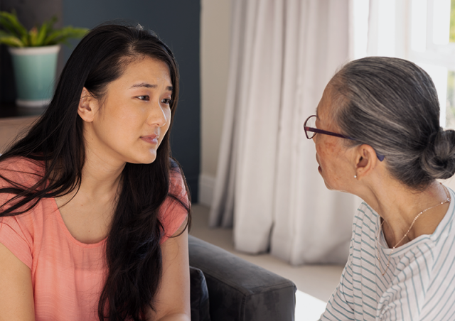 Granddaughter comforting grandmother