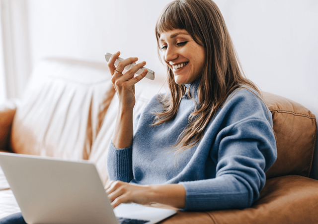 woman on laptop and phone