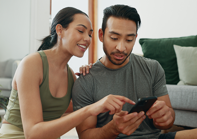 a couple looking at a phone